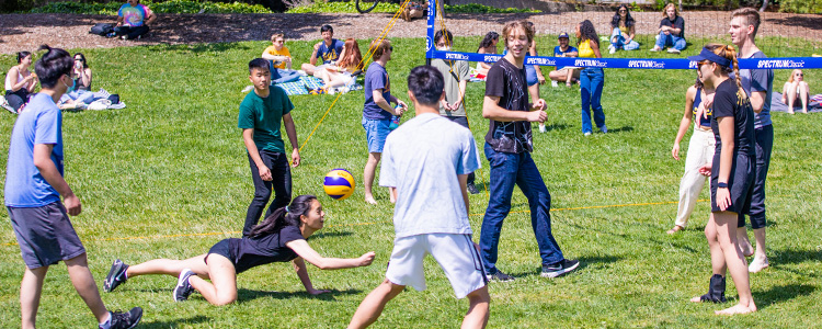 Student playing volleyball